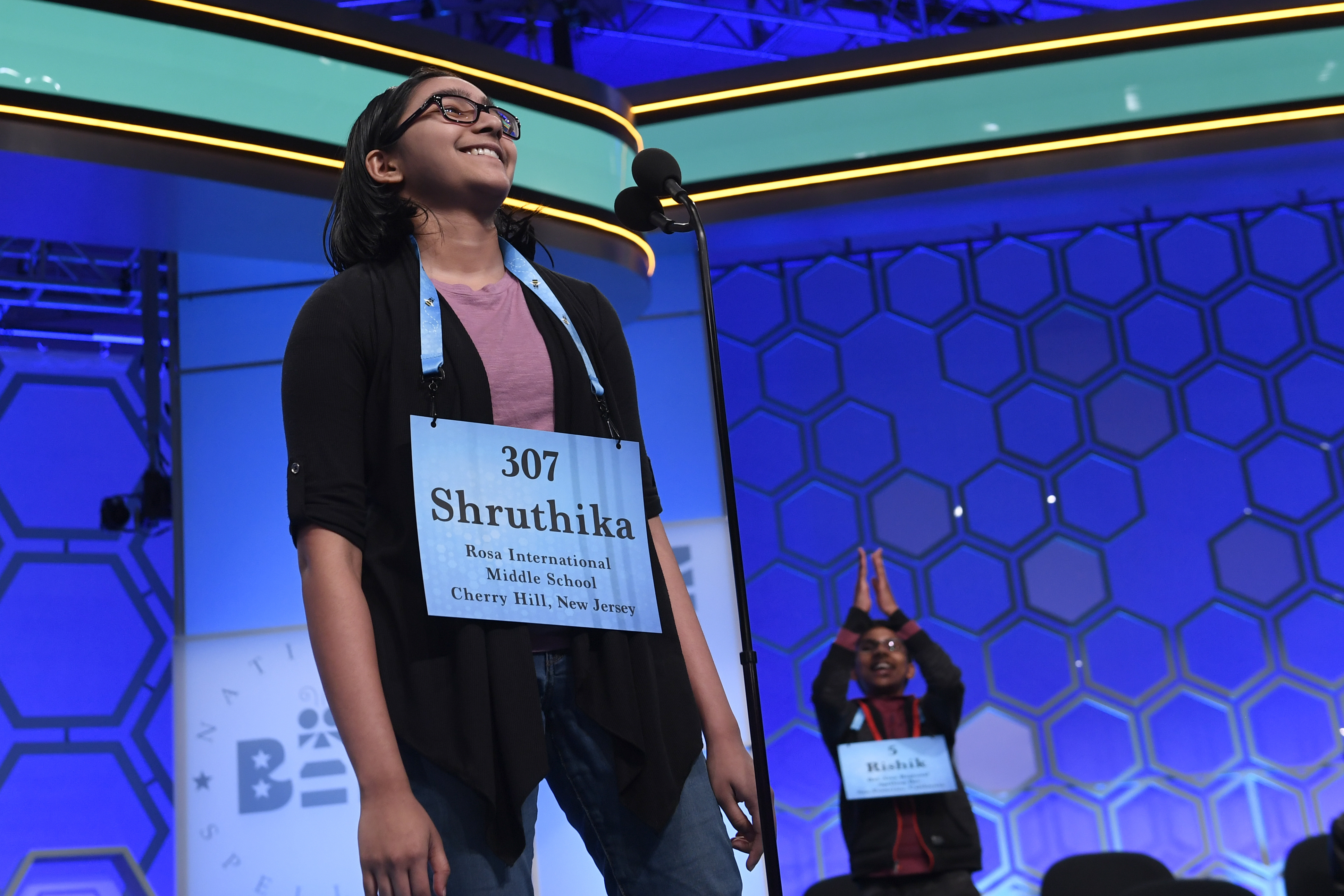 Shruthika Padhy, 13, of Cherry Hill, N.J., reacts after realizing she is one of eight co-champions of the 2019 Scripps National Spelling Bee in Oxon Hill, Md., Friday, May 31, 2019. (AP Photo/Susan Walsh)