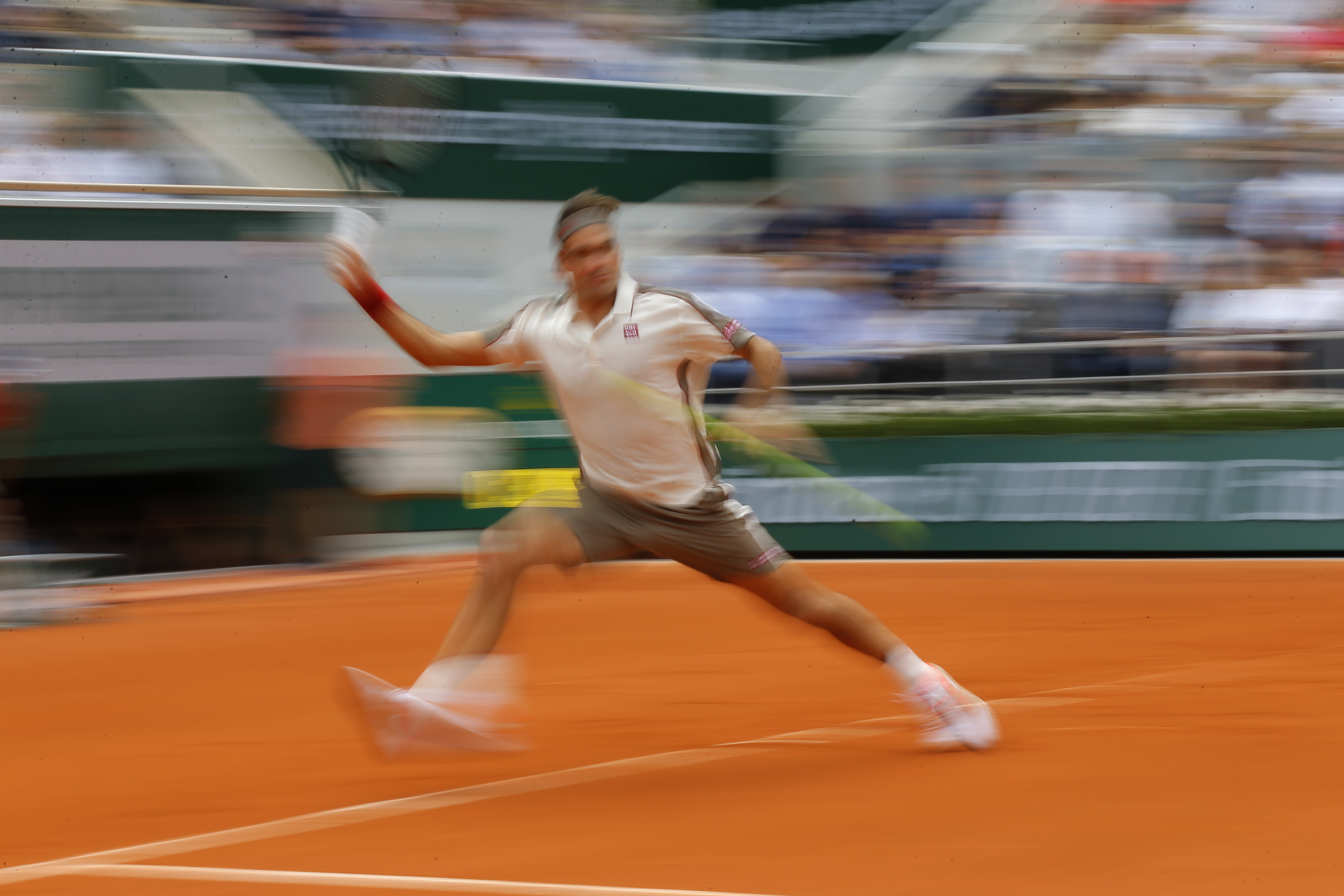 The Latest: Nadal drops set but advances at French Open