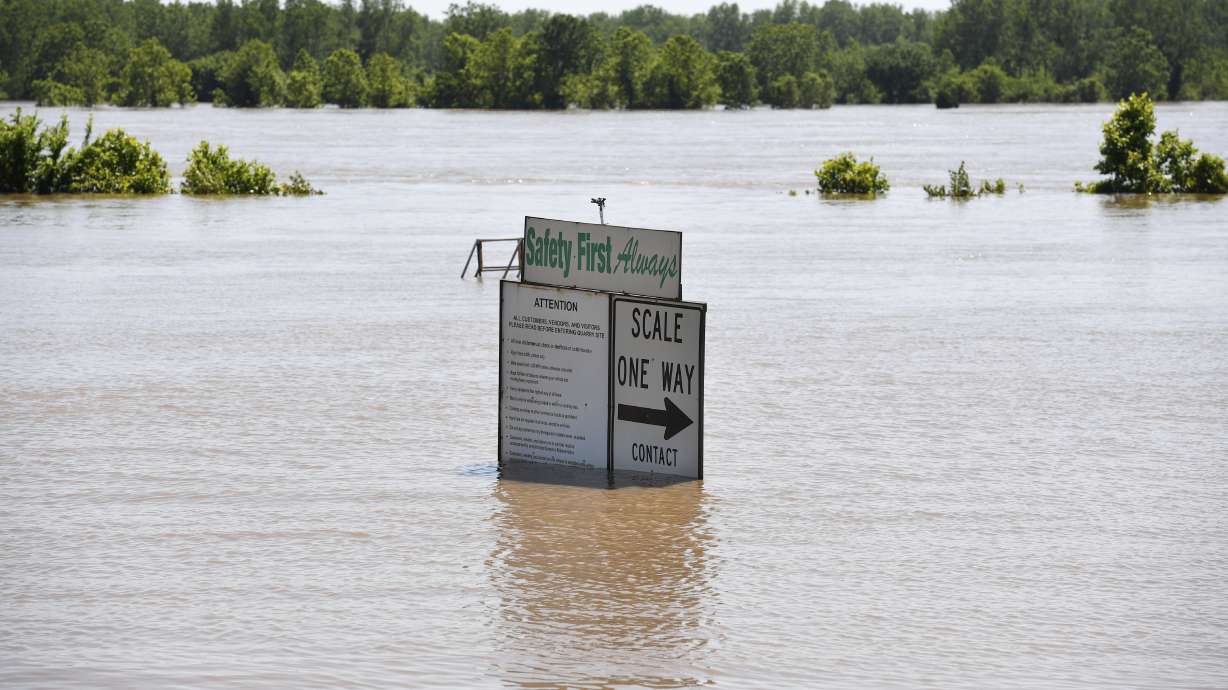 Record floods breach Arkansas levee, overtop 2 in Missouri