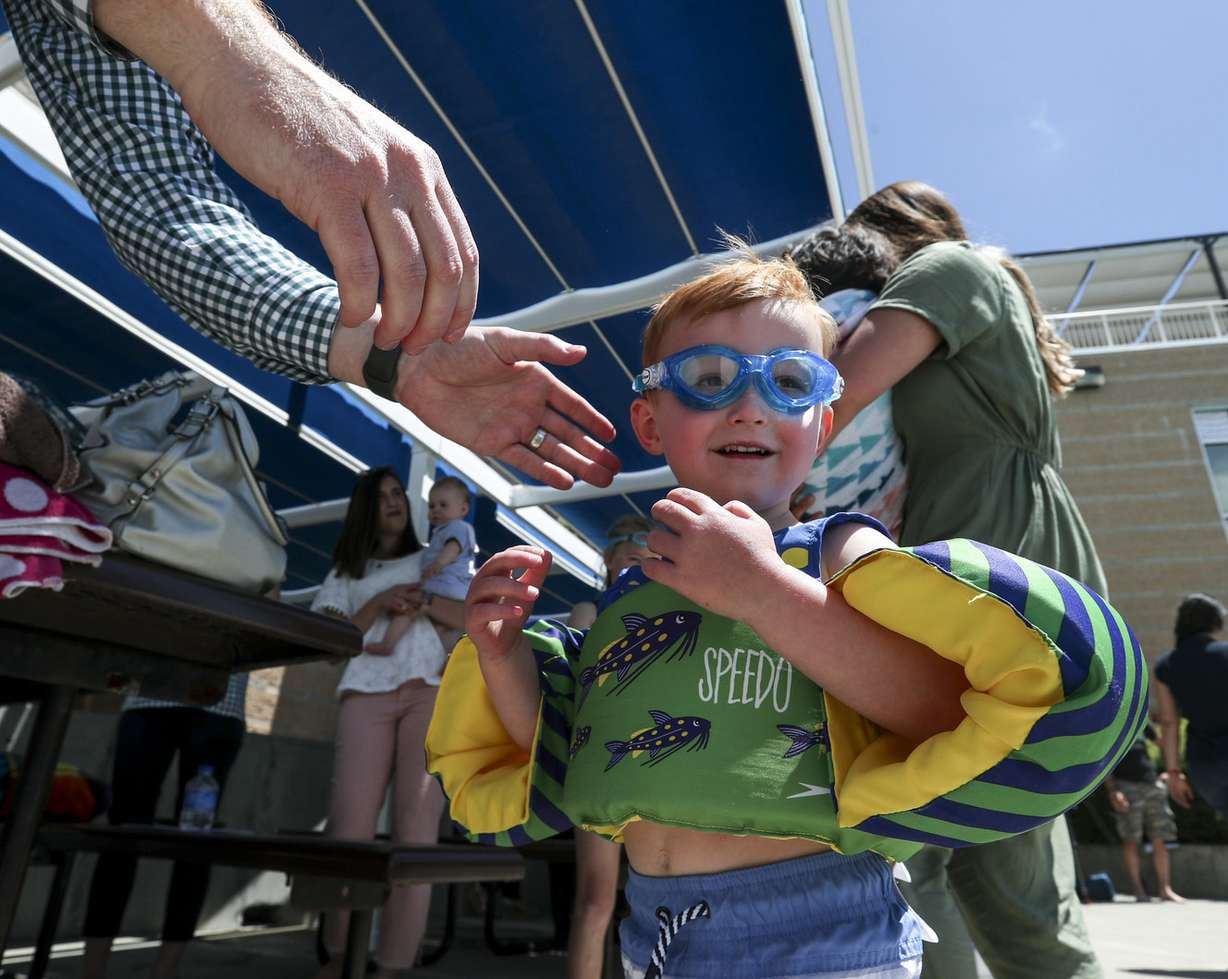 Nathan Miles, 3, gets new goggles as he gets ready to swim at the I.J. & Jeanné Wagner Jewish Community Center swimming pool in Salt Lake City on Friday, May 31, 2019. (Photo: Steve Griffin, KSL)