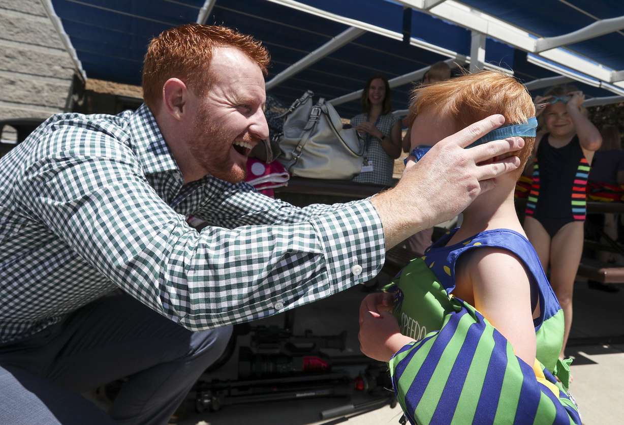 Nathan Miles, 3, gets new goggles from his dad, Todd Miles, as he gets ready to swim at the I.J. & Jeanné Wagner Jewish Community Center swimming pool in Salt Lake City on Friday, May 31, 2019. (Photo: Steve Griffin, KSL)