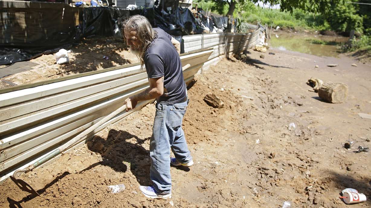 The Latest: Water rescues in tiny Missouri town