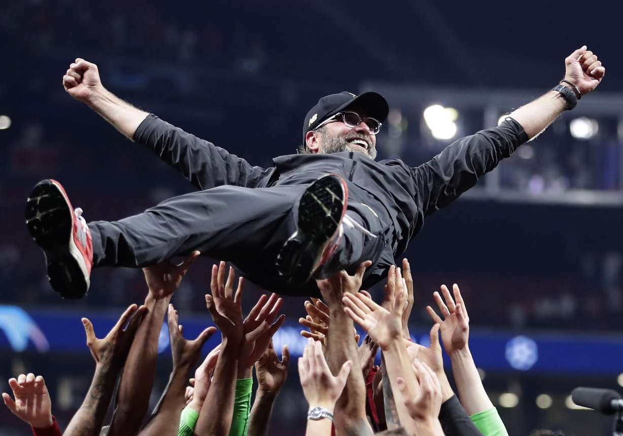 Liverpool coach Juergen Klopp is thrown into the air by player after winning the Champions League final soccer match between Tottenham Hotspur and Liverpool at the Wanda Metropolitano Stadium in Madrid, Saturday, June 1, 2019. (Photo: Emilio Morenatti, AP)