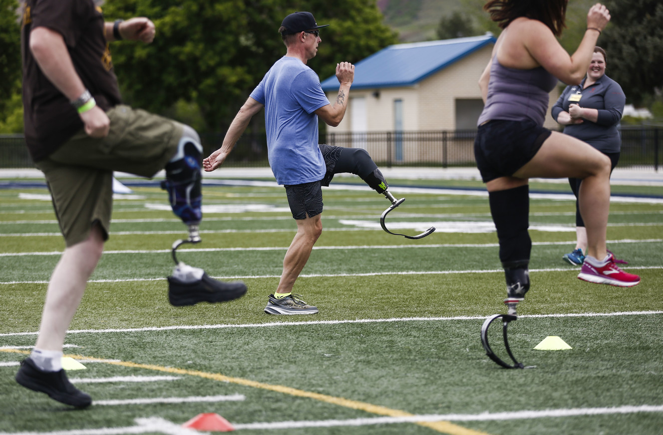 Attendees of the fourth annual Utah Adaptive Mobility Clinic work with physical therapists at Skyline High School in Salt Lake City on Saturday, June 1, 2019. The event, for or people with lower extremity limb loss or limb difference, has doubled in size since last year and is put on by Hanger Clinic. (Photo: Silas Walker, KSL)