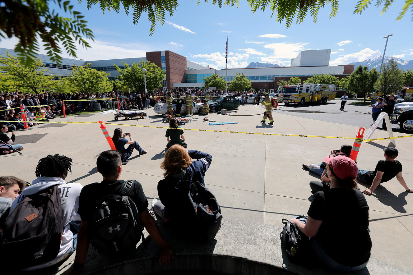 Murray High School students watch a mock car crash at the school on Friday, May 31, 2019. The demonstration was designed to remind students of the dangers and consequences of unsafe driving behaviors as they head into the summer break. (Photo: Scott G Winterton, KSL)