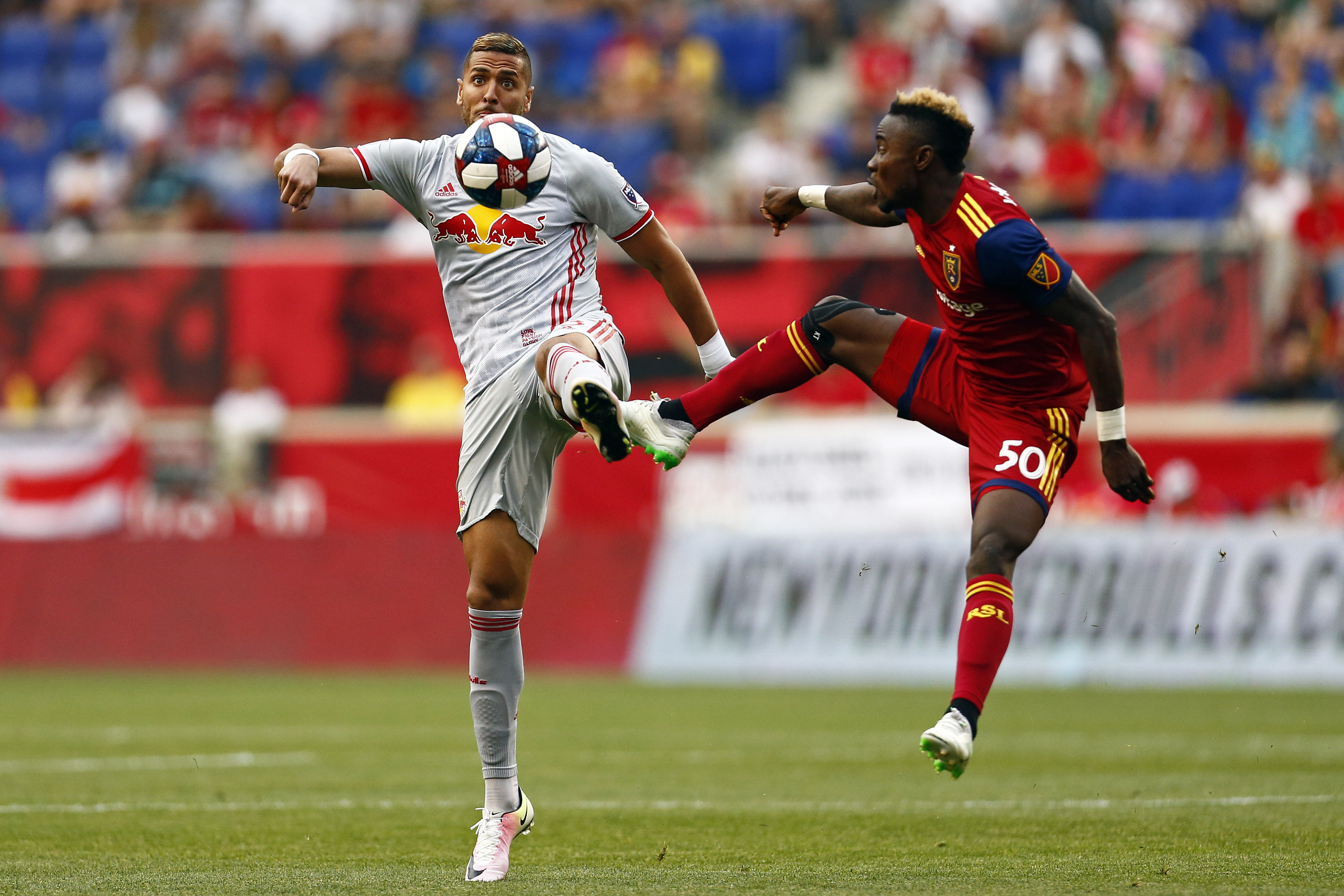 New York Red Bulls defender Amro Tarek and Real Salt Lake forward Sam Johnson (50) battle for the ball during the first half of an MLS soccer match Saturday, June 1, 2019, in Harrison, N.J. (Photo: Adam Hunger, AP)