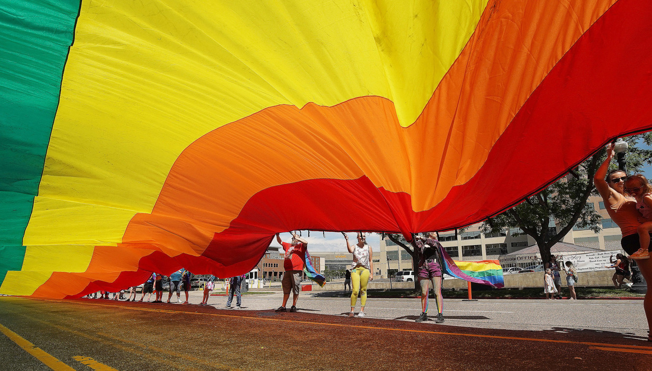 Participants try to hold a large rainbow flag as the wind gusts during the 44th annual Utah Pride Parade in Salt Lake City on Sunday, June 2, 2019. (Photo: Jeffrey D. Allred, KSL)