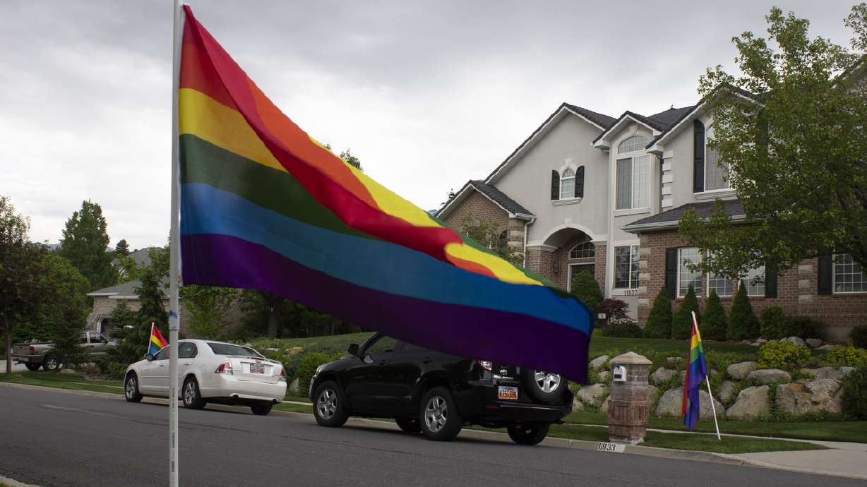 'Each person is accepted unconditionally': Sandy neighborhood lines streets with rainbow flags for Pride Week
