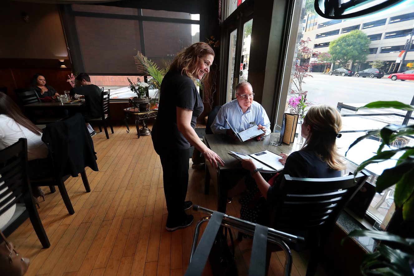 Marlen Daghlian, one of the owners of Cedars of Lebanon, talks with first-time customers Joe and Karen Orr on Friday, May 24, 2019. The Salt Lake City restaurant is preparing to close after 38 years in business. (Photo: Scott G Winterton, KSL)