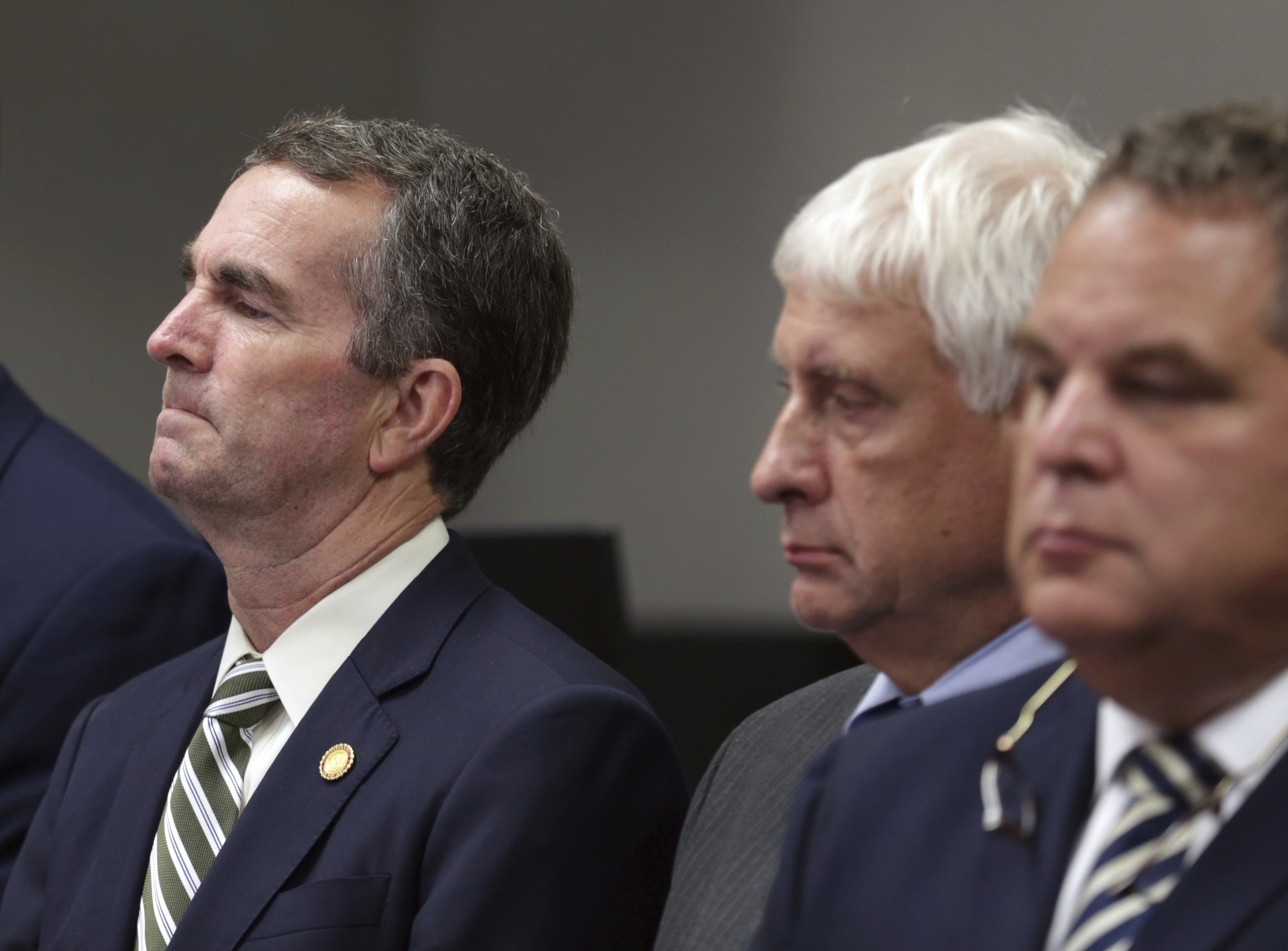 After massacre, Virginia governor demands action on guns