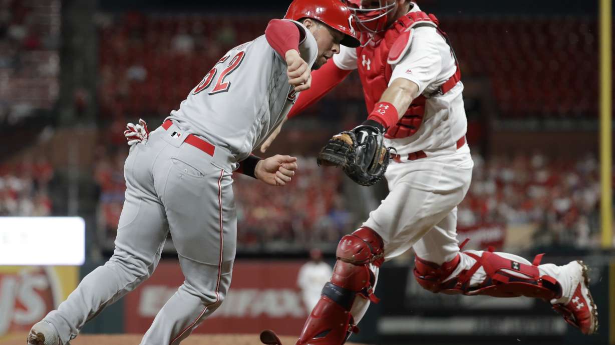 Castillo solid, Puig homers to lead Reds over Cardinals