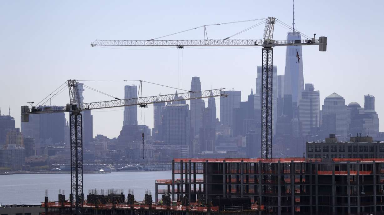 Fed says economic gains tempered by trade worries