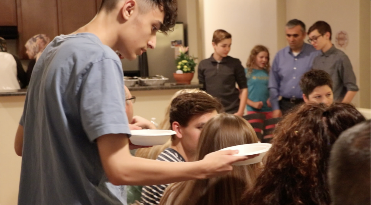 Hakan Kariparduc serves guests mushroom soup at the family's iftar dinner Saturday, June 1, 2019. (Photo: Liesl Nielsen, KSL.com)