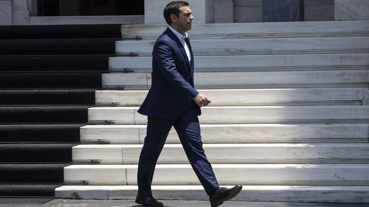 Greek leader warns of return to 'dark days' of austerity