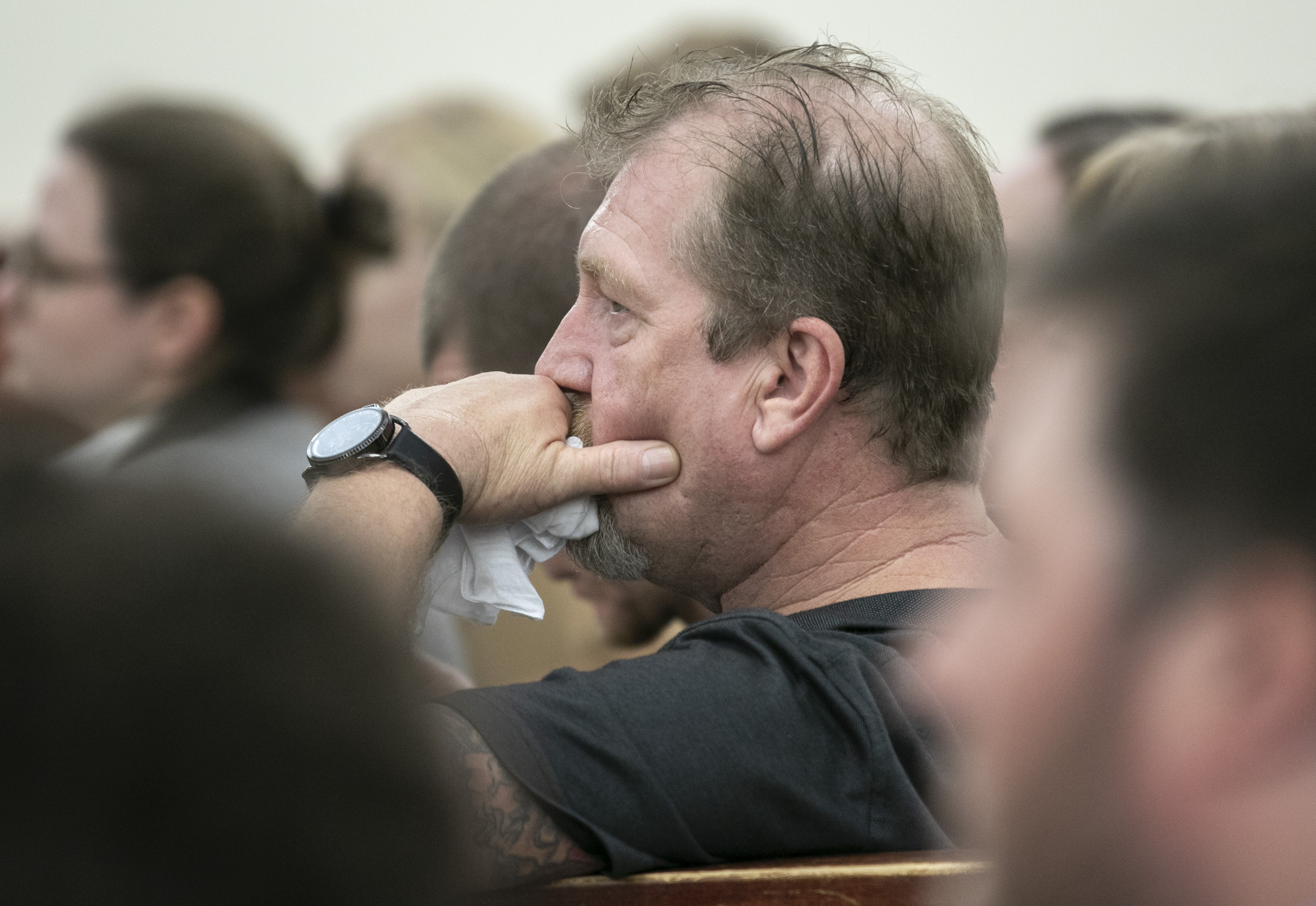 The Latest: Grisly and tender photos in dad's murder case