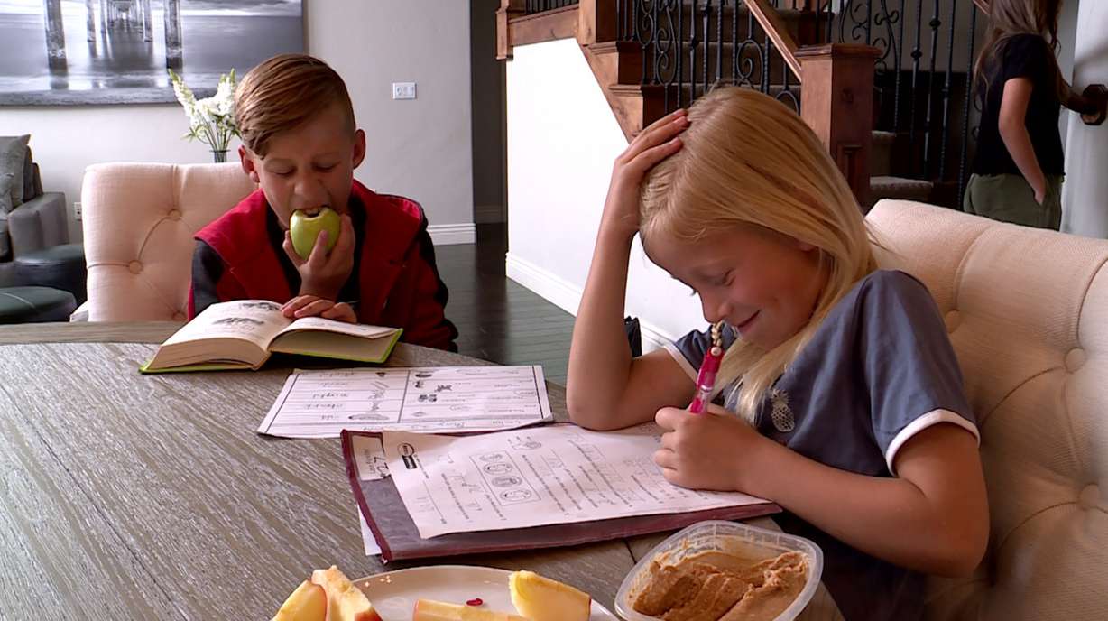 Liam and Lola Fowler eat a healthy snack as they do their after school home work. (Photo: KSL TV)