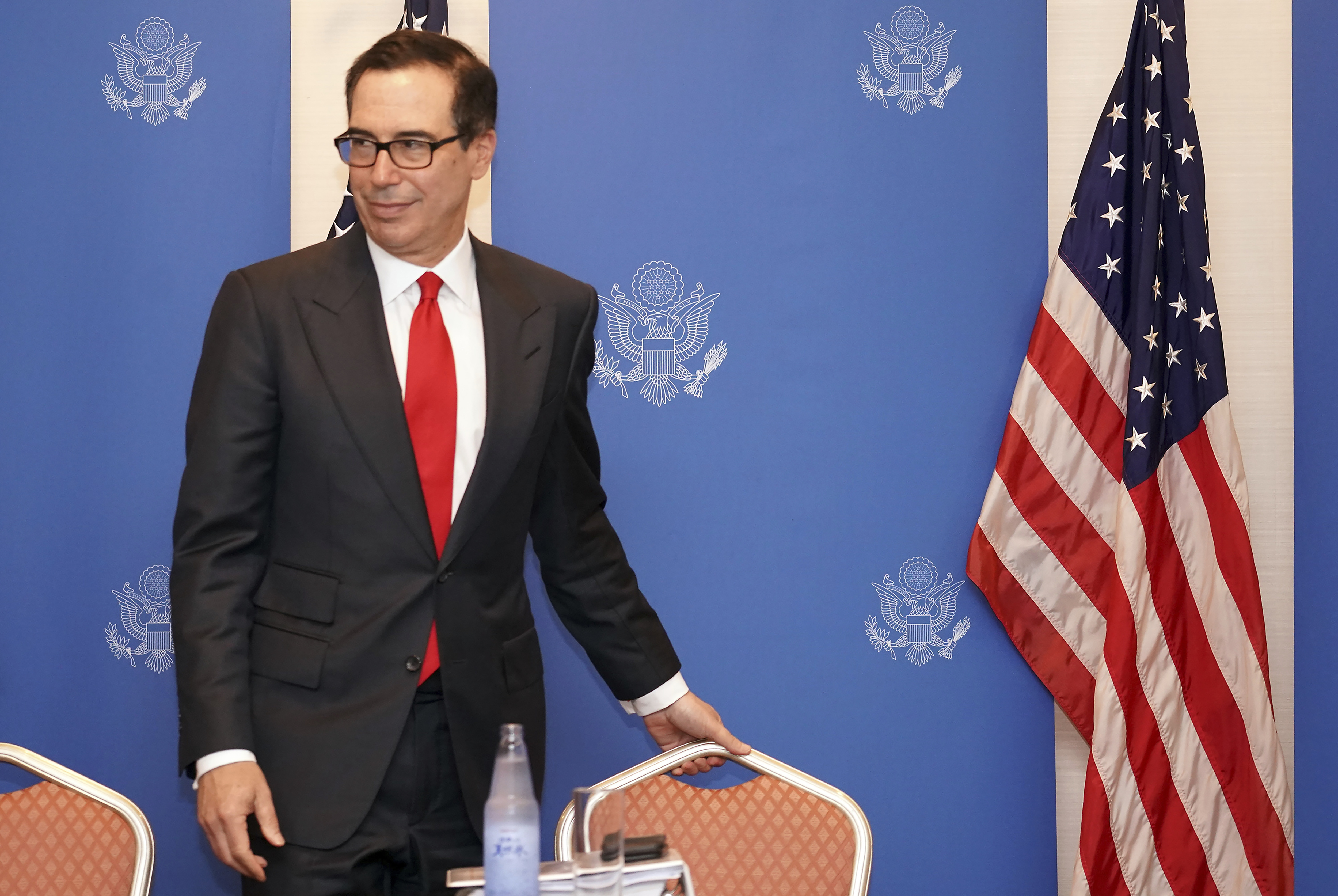 The Latest: Mnuchin to hold 1-on-1 chat with PBOC Gov. Yi