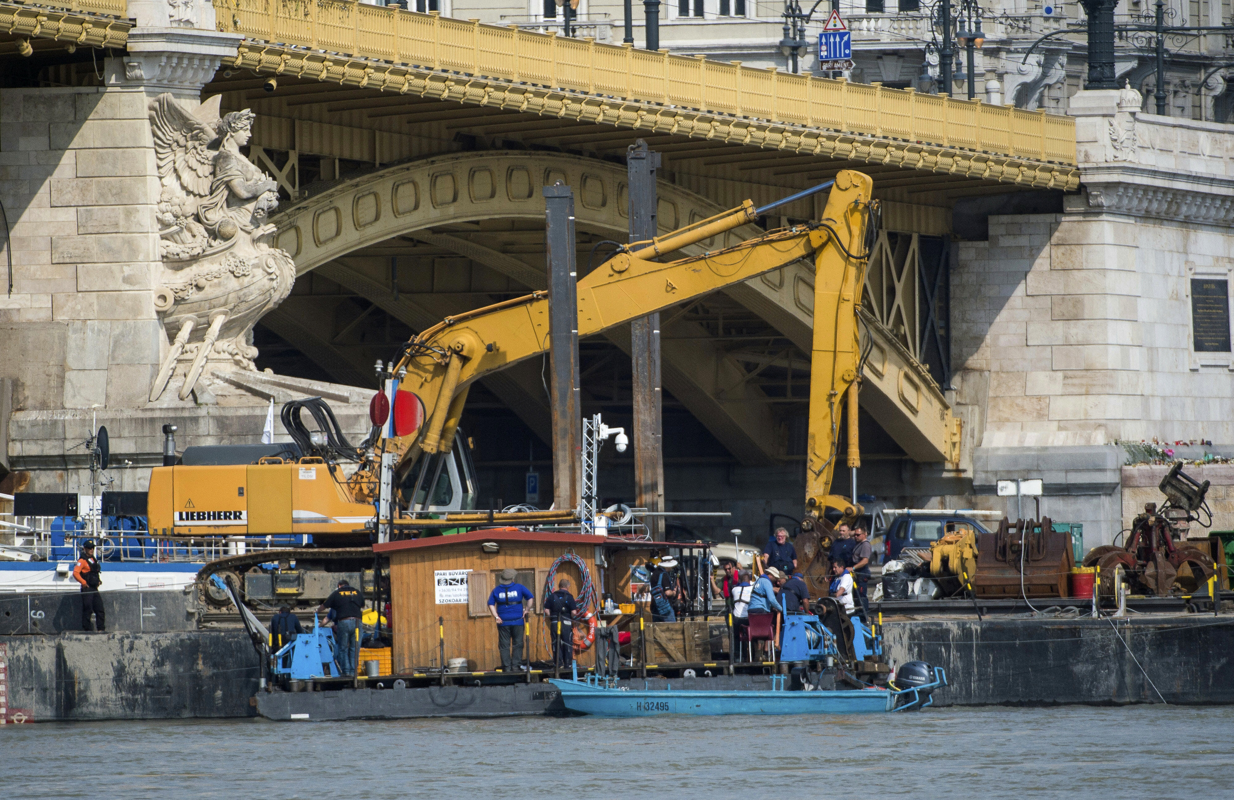 The Latest: Sunken boat unlikely to be raised before Tuesday