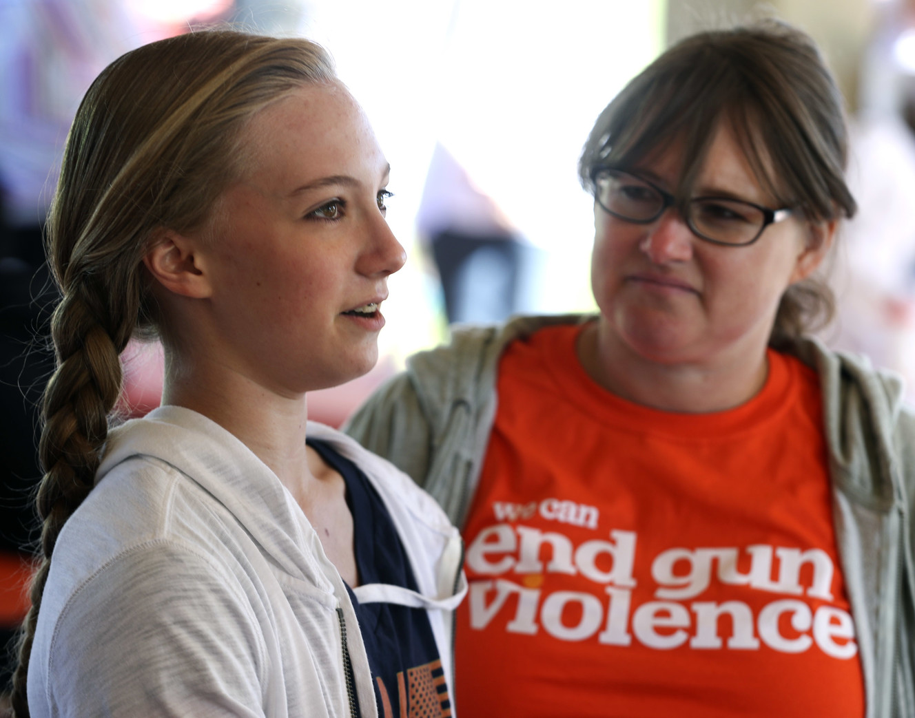 Lydia Loftus, left, and her mother Alissa Loftus talk about a lockdown situation at Mueller Park Junior High School where Lydia attended when a student brought a gun to school and fired it into the ceiling in 2017 during the Utah Wear Orange In the Park event at Sugar House Park in Salt Lake City on Saturday, June 8, 2019. (Photo: Steve Griffin, KSL)