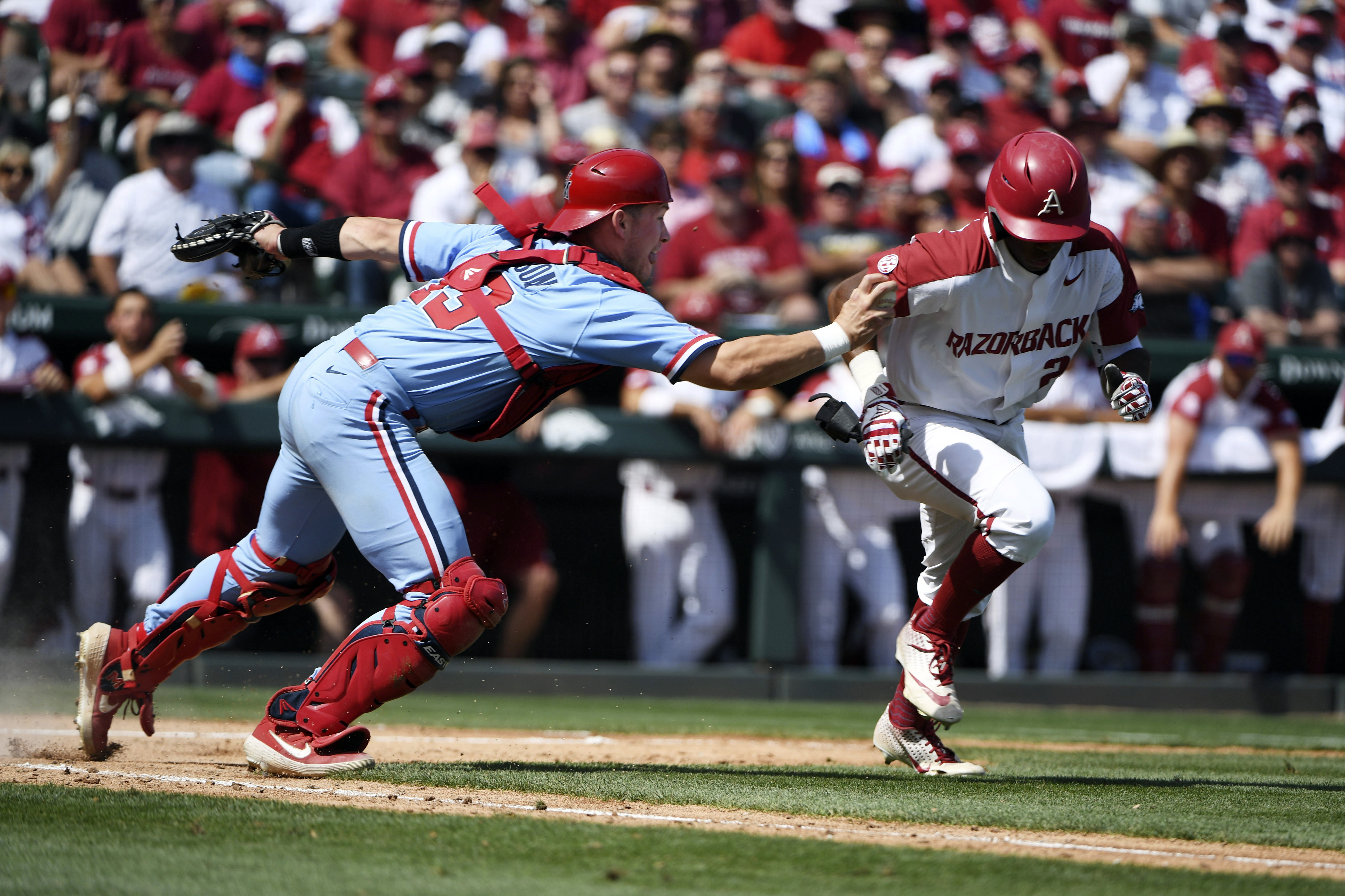Arkansas pounds Ole Miss 14-1, earns return to CWS