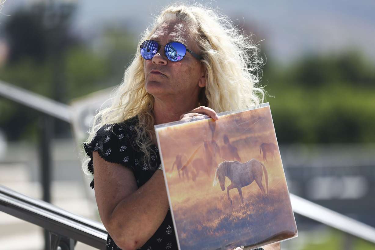 Shauna Muztafago, of Salt Lake City, protests legislation proposed by Rep. Chris Stewart, R-Utah, that would allow the BLM to cull, extract and euthanize wild horses and burros on Utah's public lands during a rally at the Capitol in Salt Lake City on Monday, June 10, 2019. (Photo: Silas Walker, KSL)