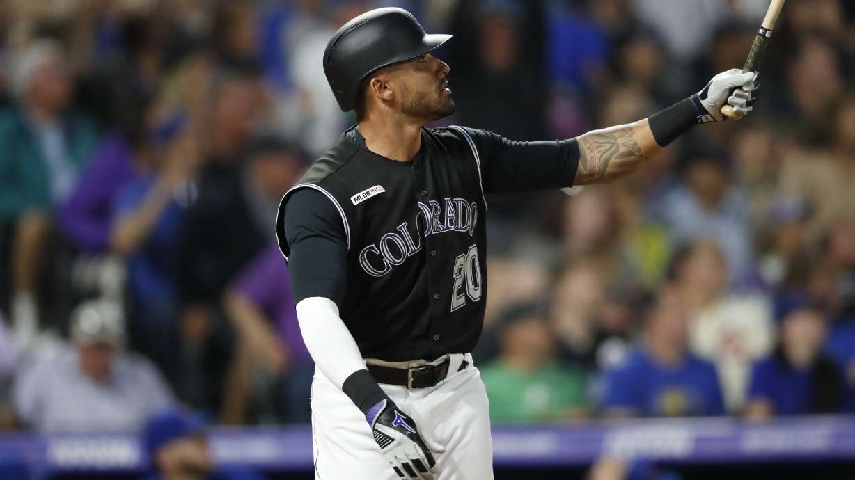 Powerful Rockies rally past Cubs, 9th straight win at home