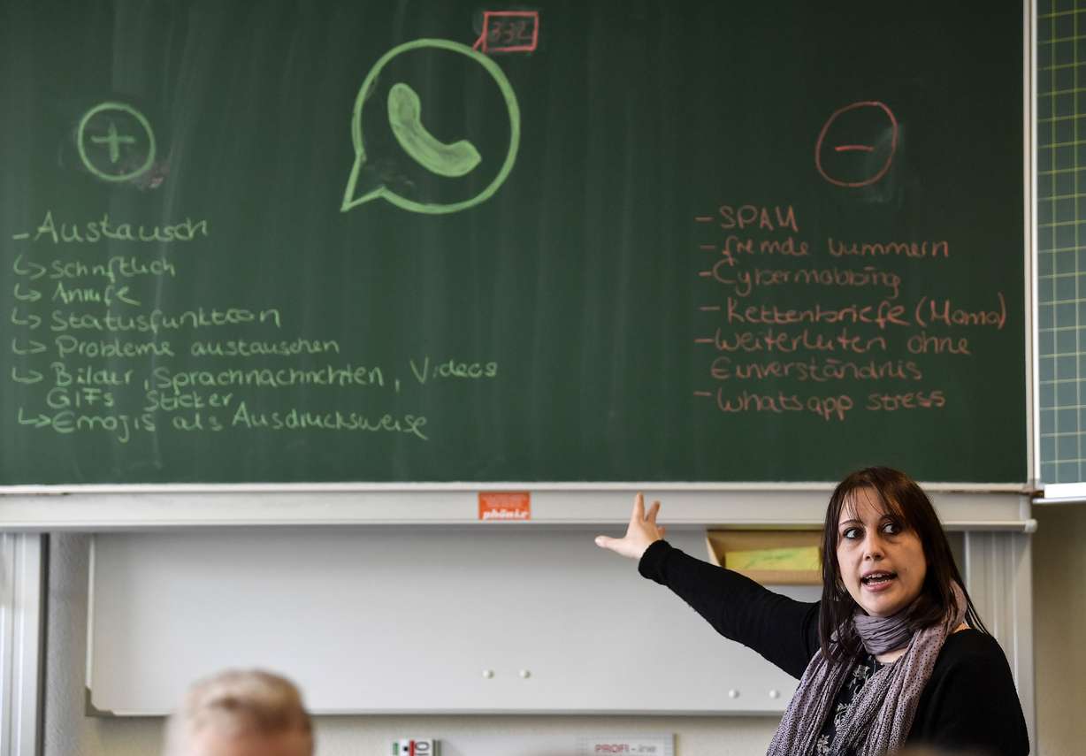 Teacher Vera Servaty talks to pupils during a lesson in social media and internet, at a comprehensive school in Essen, Germany, Monday, March 18, 2019. Photo: Martin Meissner, AP Photo