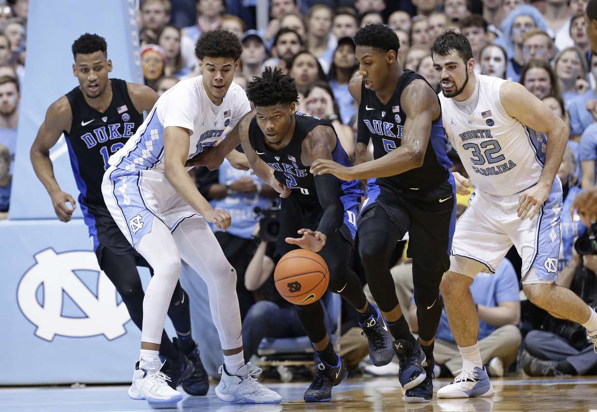 North Carolina's Cameron Johnson and Luke Maye (32) chase the ball with Duke's Javin DeLaurier, left, Cam Reddish (2) and RJ Barrett during the second half of an NCAA college basketball game in Chapel Hill, N.C., Saturday, March 9, 2019. North Carolina won 79-70. (Photo:Gerry Broome, AP Photo.)