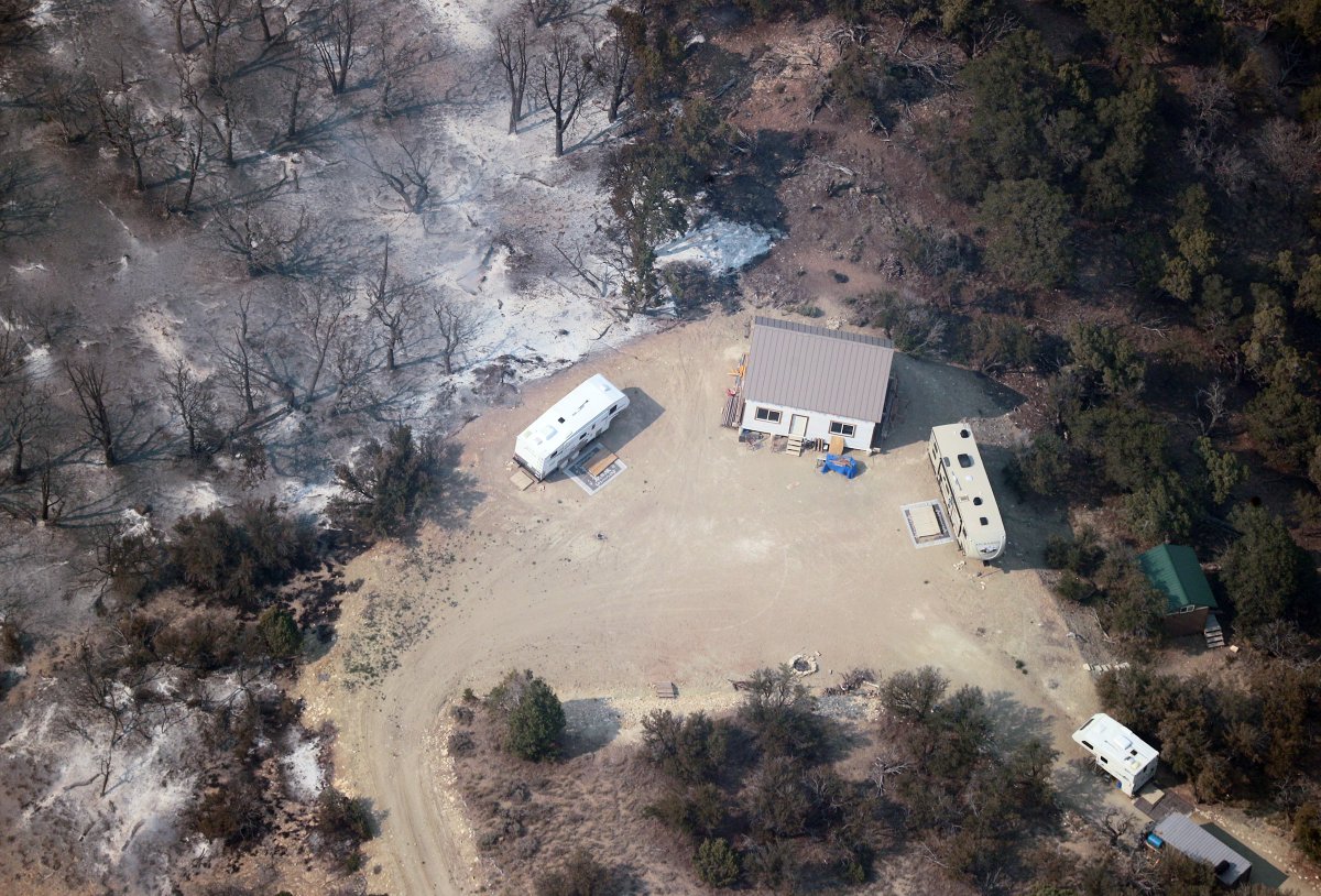 A structure and trailers that escaped damage from the Dollar Ridge Fire east of Strawberry Reservoir are pictured on Tuesday, July 3, 2018. The fire, which continues to burn, has claimed several structures. (Photo: Scott G Winterton, KSL, File)
