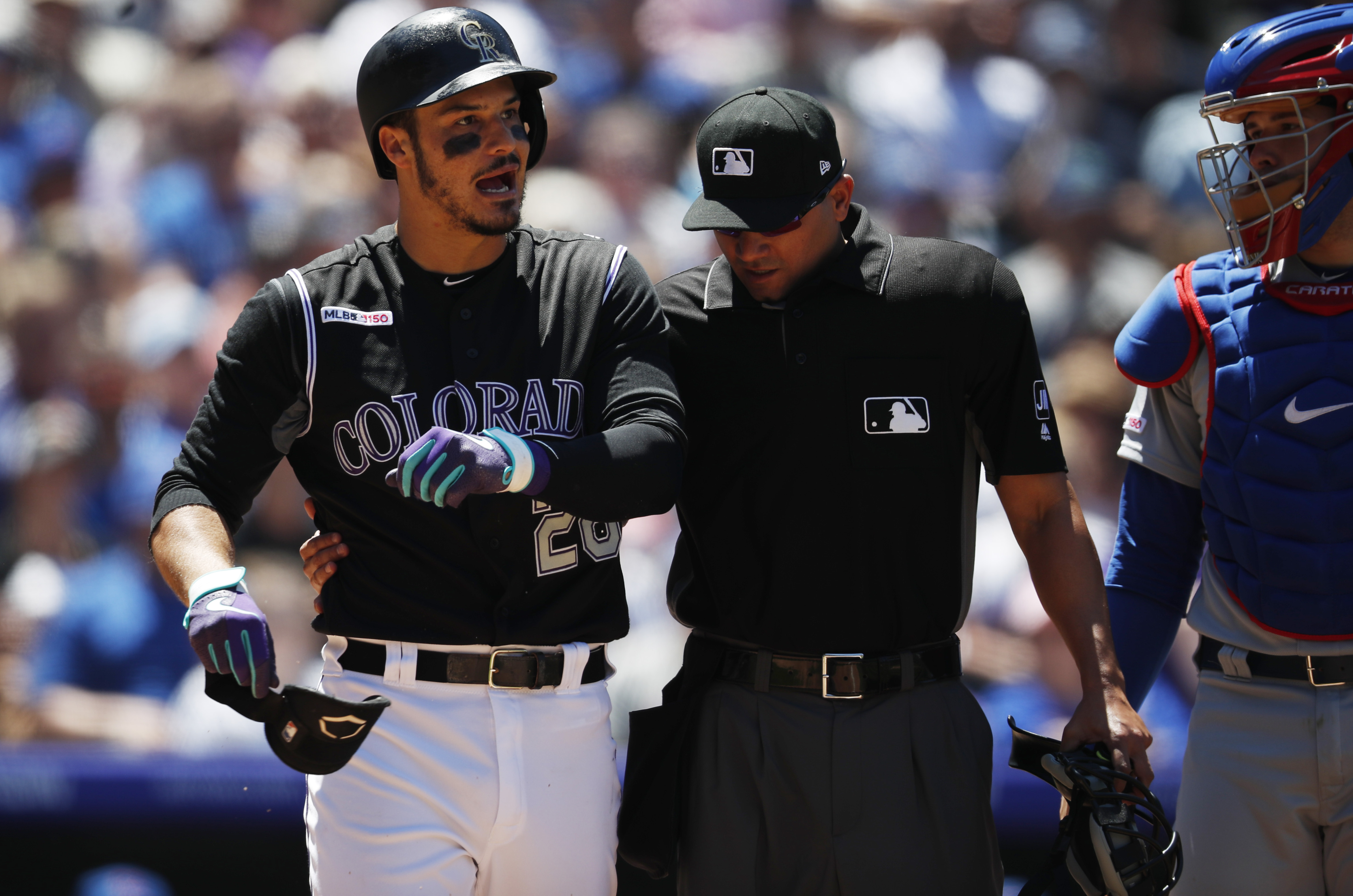 Rockies 3B Arenado hit by pitch on left forearm, leaves game