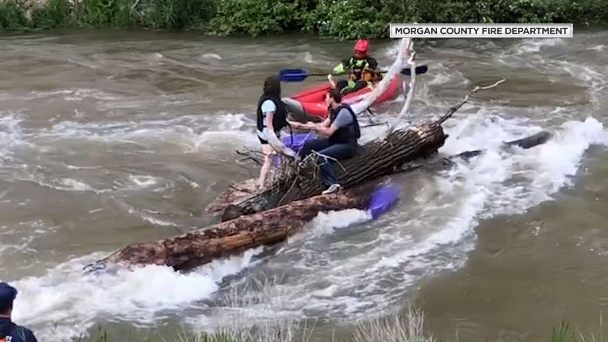 Swift Water Rescue Captain Eric Turner says a family of five lost their raft as it collided with a pile of logs and branches, and deflated on Tuesday, June 11, 2019. (Mike Anderson via Morgan COunty Fire Department)