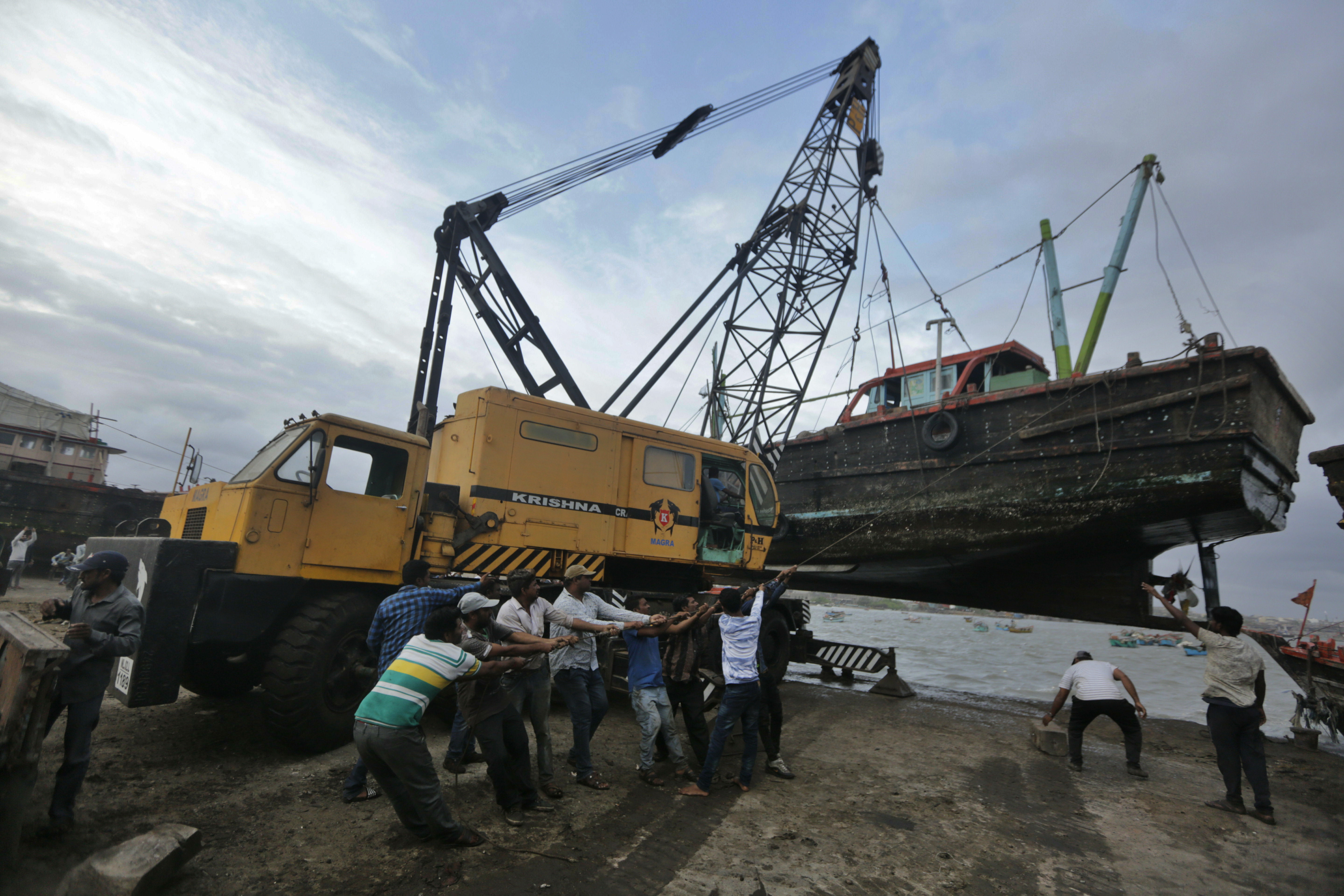 Cyclone batters fishing hub but veers away from Indian coast