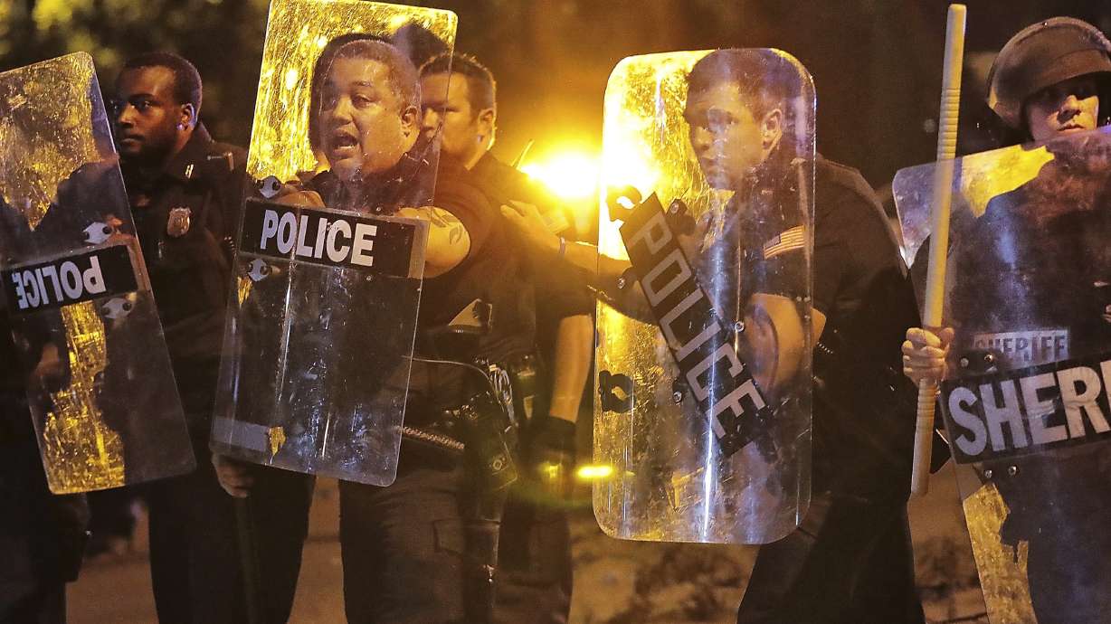 The Latest: Dozens gather peacefully after Memphis shooting