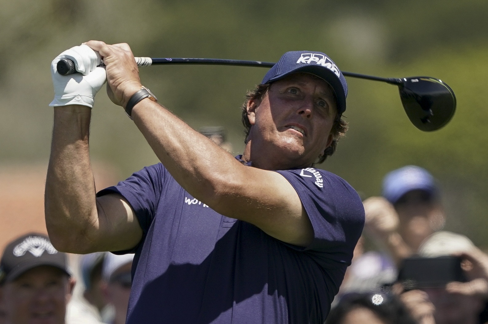 The Latest: Rose birdies last 3 holes to lead Open