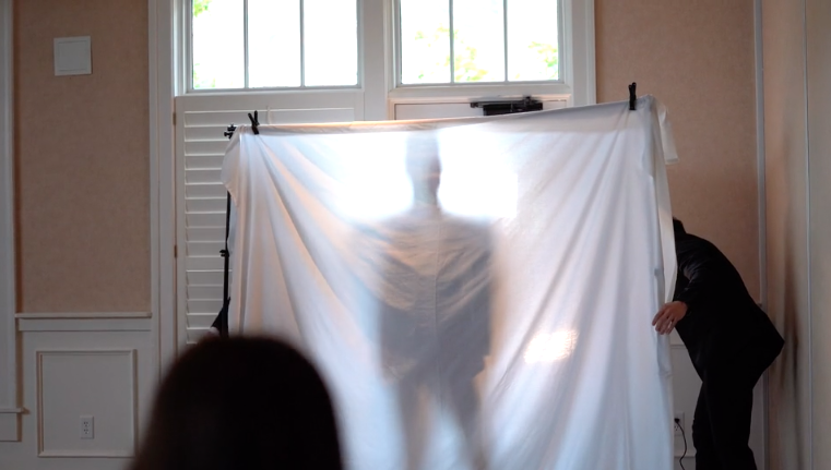 The millionaire stood behind a sheet clamped to some poles with a light shining behind, so the women could see his silhouette. (Photo: Courtesy of LDS Matchmakers)