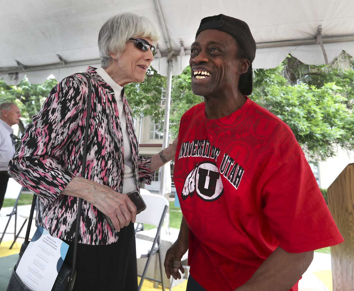 Community advocate Pamela Atkinson laughs with Don Williams, a resident at Palmer Court in Salt Lake City, during the Road Home’s celebration of the facility's 10th anniversary on Thursday, June 13, 2019. (Photo: Steve Griffin, KSL)
