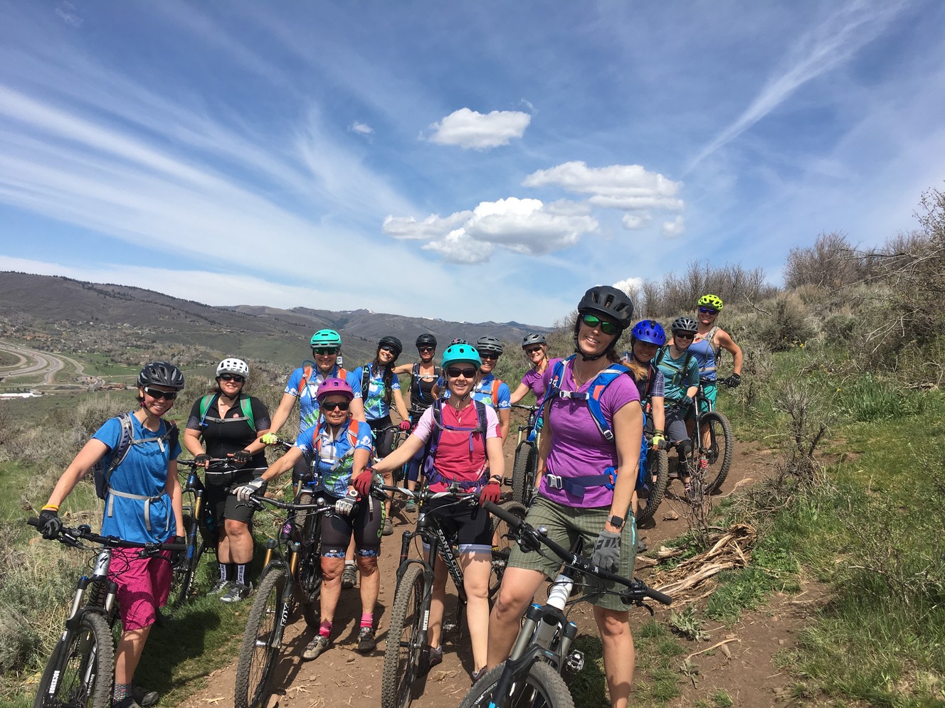 Park City mountain biker Cyndi Schwandt, seen here in the center in the purple helmet, died Monday in a bike crash. Fellow riders remembered Schwandt as a "pioneer" of the mountain biking community in the area who was always willing to help others. (Photo: Courtesy of Kari Murray/Team Sugar)