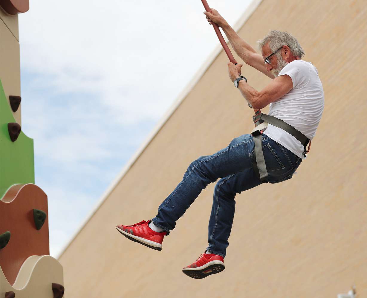 Veteran Bill Hughes scales a climbing wall during a Recreation Fair at the George E. Wahlen Department of Veterans Affairs Medical Center in Salt Lake City on Friday, June 14, 2019. (Photo: Jeffrey D. Allred, Deseret News)