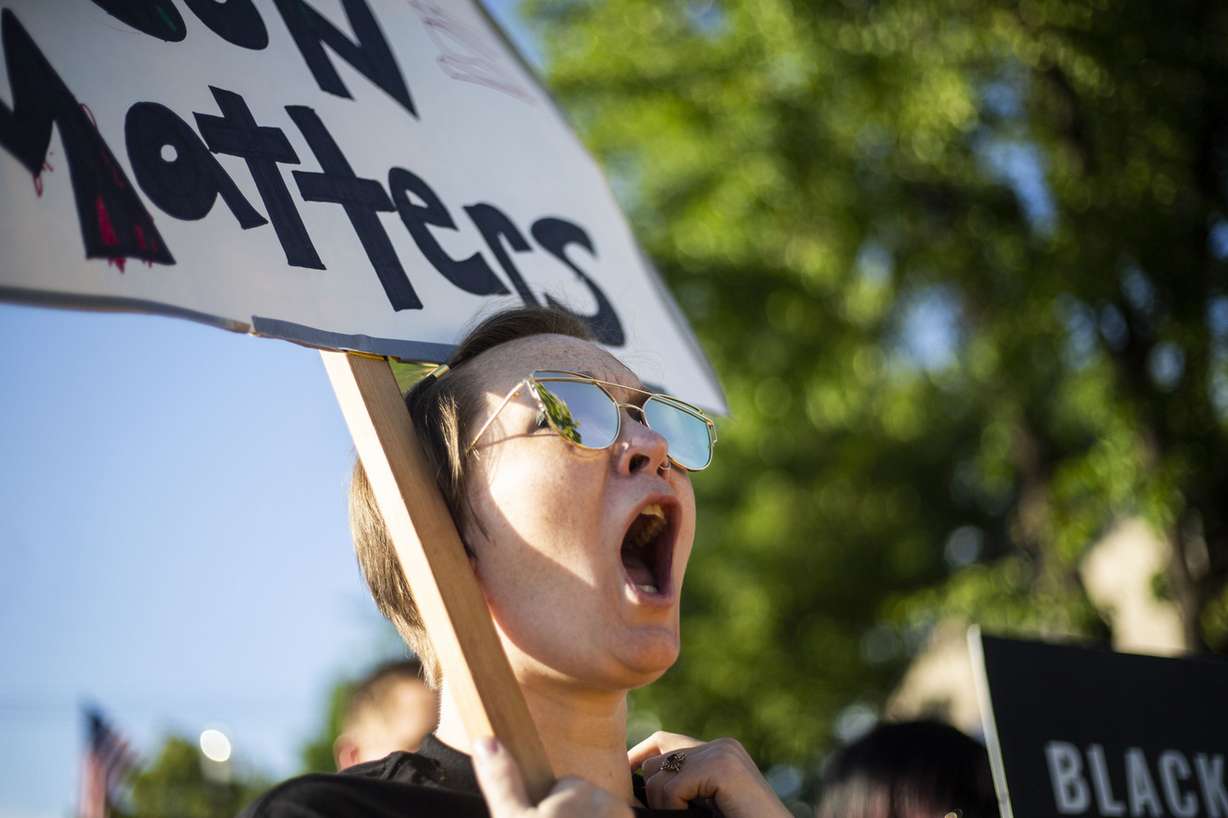 Preslie Paur, a Salt Lake City resident, holds a sign at a rally at the Woods Cross Police Department on Friday, June 14, 2019. Black Lives Matter Utah was the primary organizer of the event in support of DJ Hrubes, a 10-year-old black child who family members say had a gun pointed at him by a Woods Cross police officer while he was playing in his grandmother's front yard. "I am terrified that this will happen my 4 year-old son," Paur said. (Photo: Silas Walker, Deseret News)
