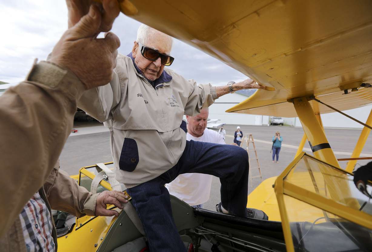 Retired Air Force Lt. Col. Bill Willis, 97, climbs into a Boeing-Stearman at the Morgan County Airport in Morgan before a flight on Friday, June 14, 2019. (Photo: Kristin Murphy, KSL)