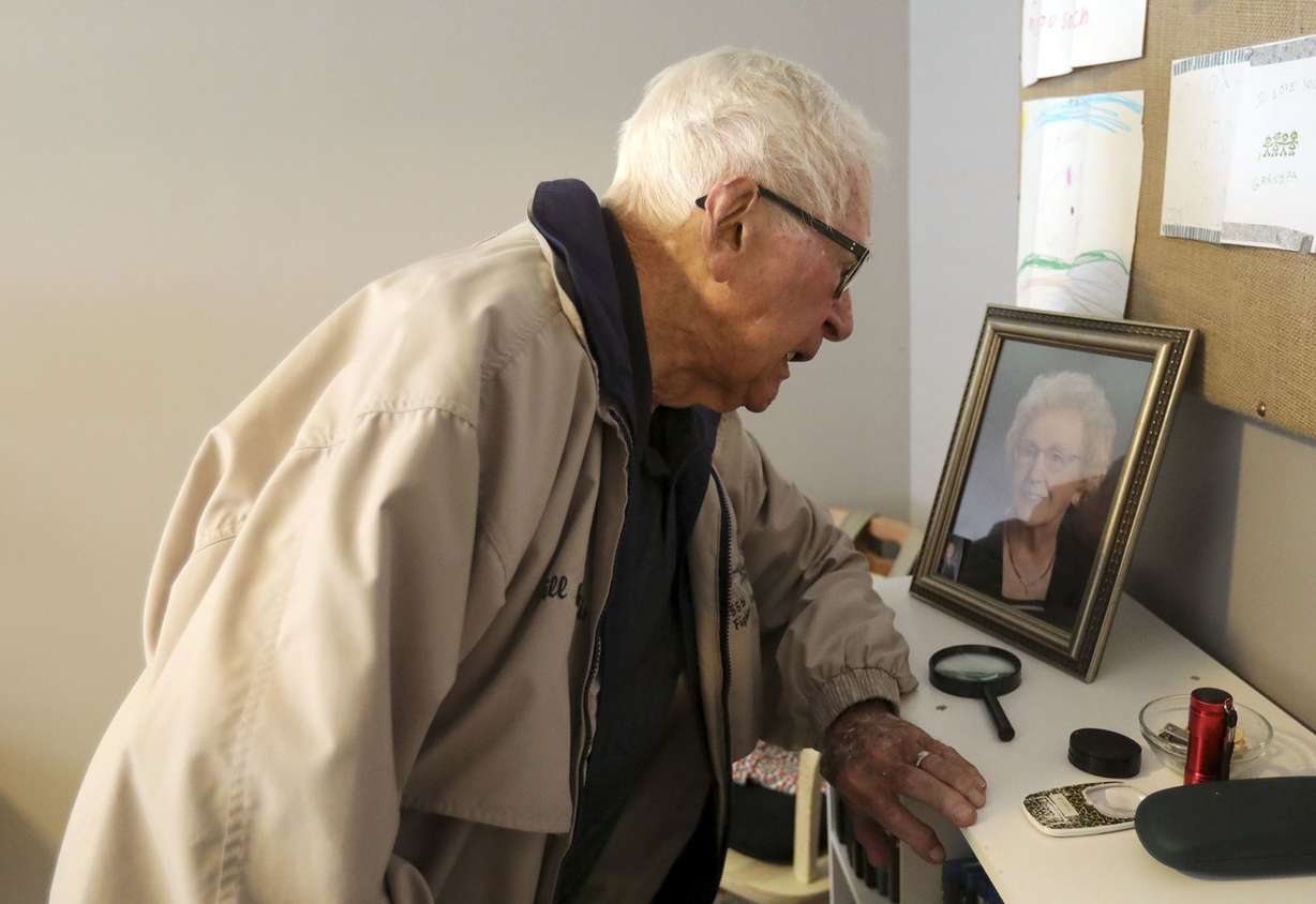 Retired Air Force Lt. Col. Bill Willis, 97, talks to a picture of his wife of 73 years, who recently passed away, and tells her that "They're embarrassing me," (speaking of all the media attention) at his granddaughter's home in Kaysville on Friday, June 14, 2019. (Photo: Kristin Murphy, KSL)