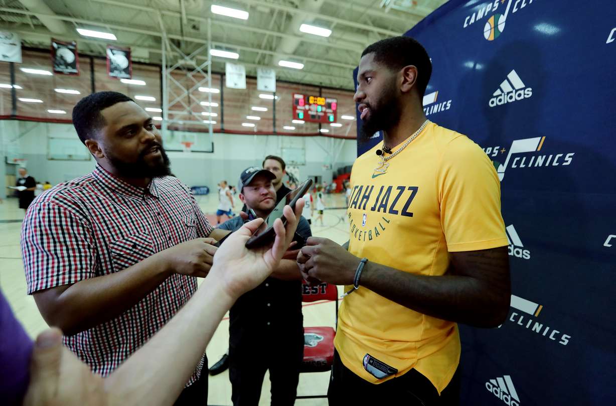 Utah Jazz's Royce O'Neale talks with media members as young fans take part in a clinic at West High School in Salt Lake City on Monday, June 17, 2019. (Scott G Winterton, KSL)