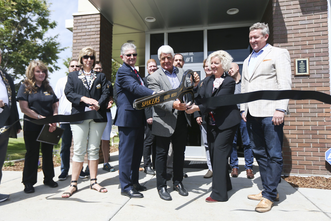 Members of the Ogden-Weber Chamber watch as managing director Peter Moran, sixth from left, Rep. Rob Bishop, R-Utah, Alison Petchell, from the Australian Embassy, and Ogden Mayor Mike Caldwell, right, cut the ribbon for Australia-based KordTech's new facility in Ogden on Monday, June 17, 2019. Photo: Silas Walker, KSL