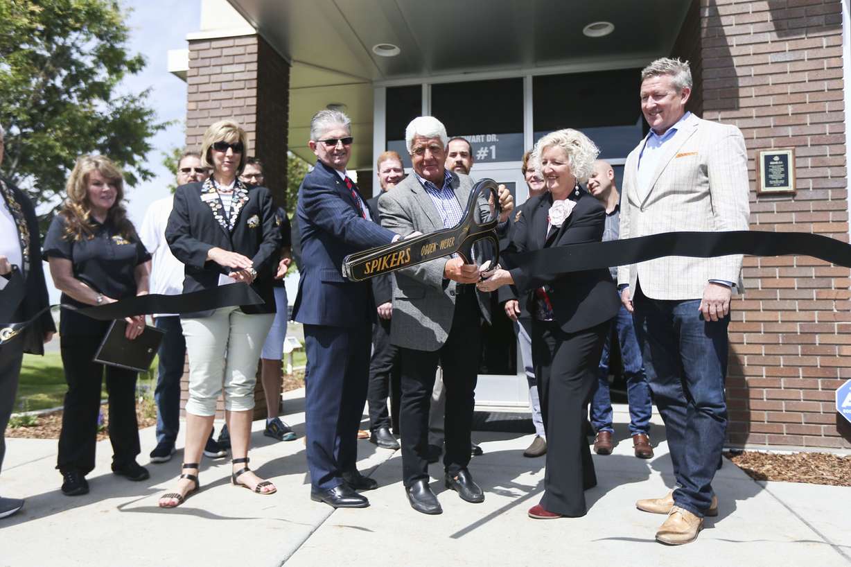 Members of the Ogden-Weber Chamber watch as managing director Peter Moran, sixth from left, Rep. Rob Bishop, R-Utah, Alison Petchell, from the Australian Embassy, and Ogden Mayor Mike Caldwell, right, cut the ribbon for Australia-based KordTech's new facility in Ogden on Monday, June 17, 2019. Photo: Silas Walker, KSL