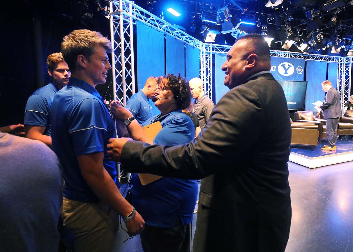 BYU head coach Kalani Sitake laughs with BYU quarterback Zach Wilson (11) during football media day in Provo on Tuesday, June 18, 2019. (Photo: Jeffrey D. Allred, KSL)