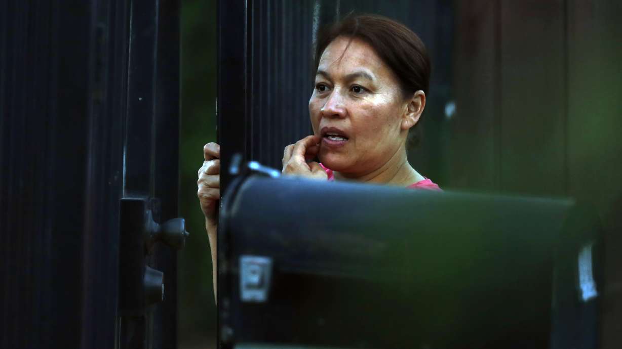 The Latest: Suspect in Sacramento officer killing surrenders