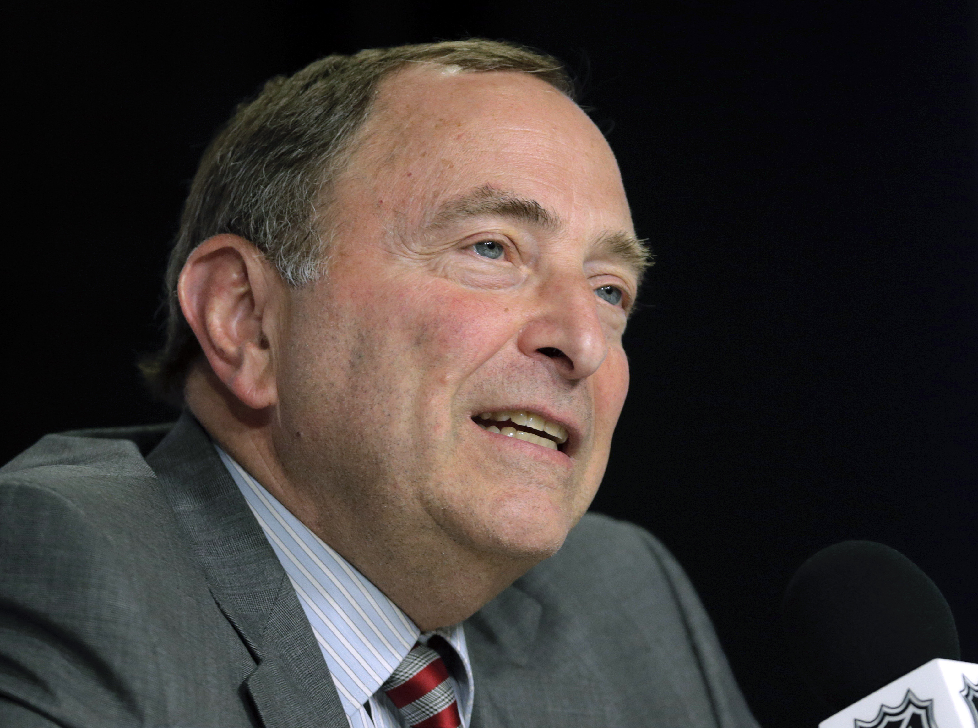 AP Source: NHL salary cap will fall short of projections