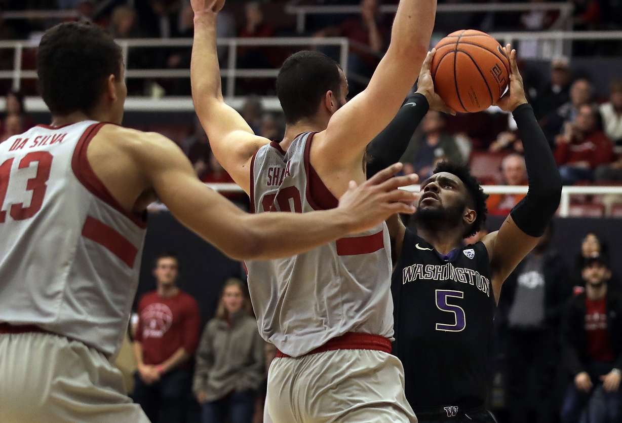 Washington's Jaylen Nowell, right, shoots against Stanford's Josh Sharma and Oscar Da Silva (13) in the second half of an NCAA college basketball game Sunday, March 3, 2019, in Stanford, Calif. (Photo: Ben Margot, AP)