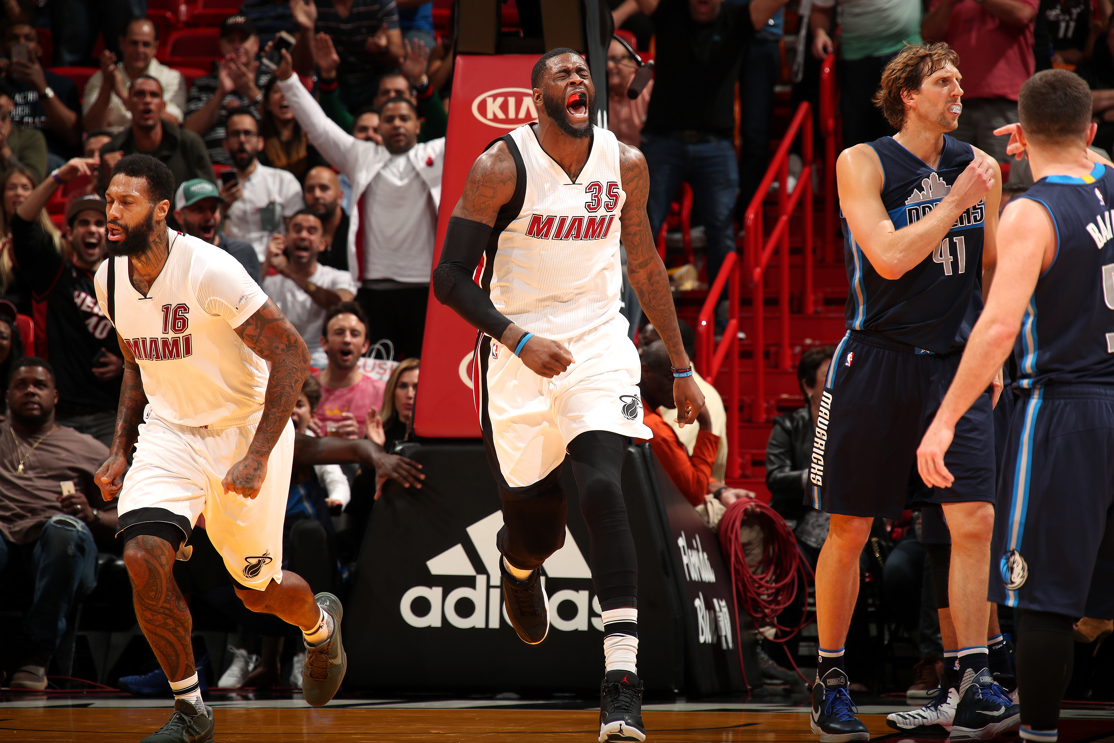 Willie Reed of the Miami Heat, center, reacts during the game against the Dallas Mavericks on January 19, 2017 at AmericanAirlines Arena in Miami, Florida. Mandatory Copyright Notice: Copyright 2017 NBAE (Photo by Issac Baldizon, NBAE via Getty Images)