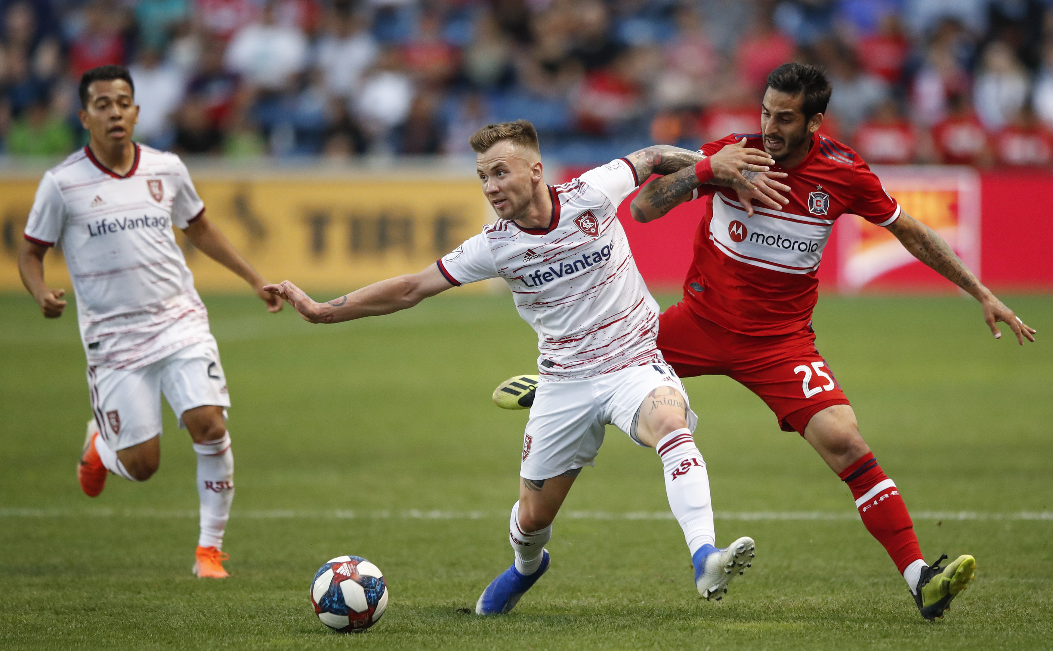 Real Salt Lake midfielder Albert Rusnak (11) keeps the ball away from Chicago Fire defender Jorge Luis Corrales (25) during the first half of an MLS soccer match Saturday, June 22, 2019, in Bridgeview, Ill. (Photo: Kamil Krzaczynski, AP)